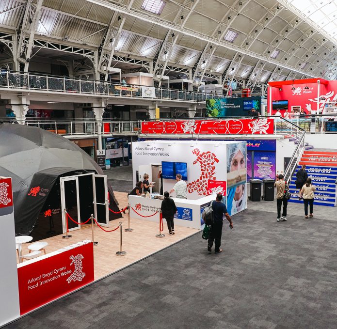 Taste Wales 2022, with view of the 360 Dome and Wales branded stands, with people walking around.